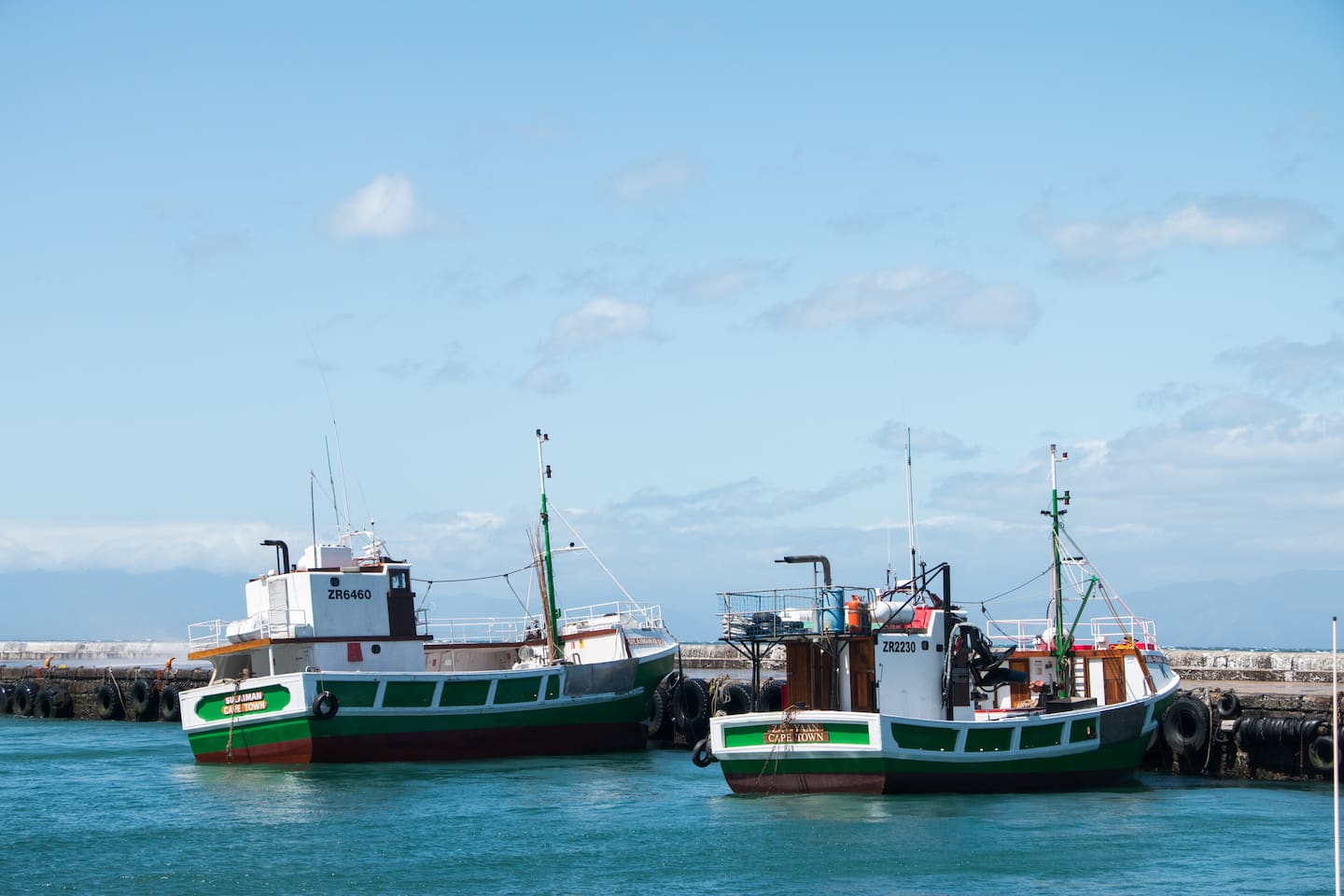 Fishing boats moored in Kalk Bay harbour, near The Majestic Apartment